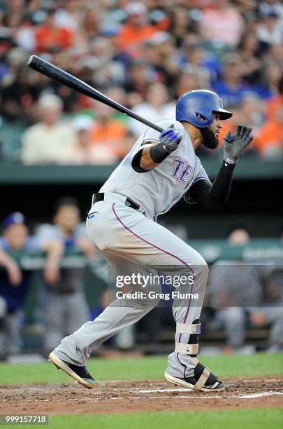 Nomar Mazara of the Texas Rangers hits a single in the third inning against the Baltimore Orioles at Oriole Park at Camden Yards on July 14, 2018 in...