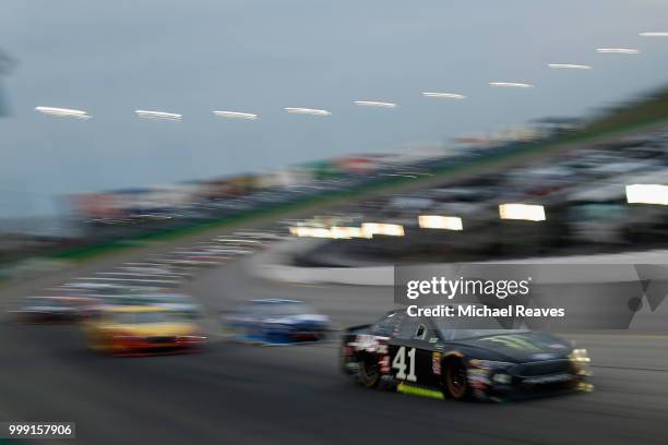 Kurt Busch, driver of the Monster Energy/Haas Automation Ford, leads a pack of cars during the Monster Energy NASCAR Cup Series Quaker State 400...