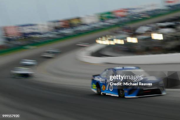 Martin Truex Jr., driver of the Auto-Owners Insurance Toyota, leads a pack of cars during the Monster Energy NASCAR Cup Series Quaker State 400...