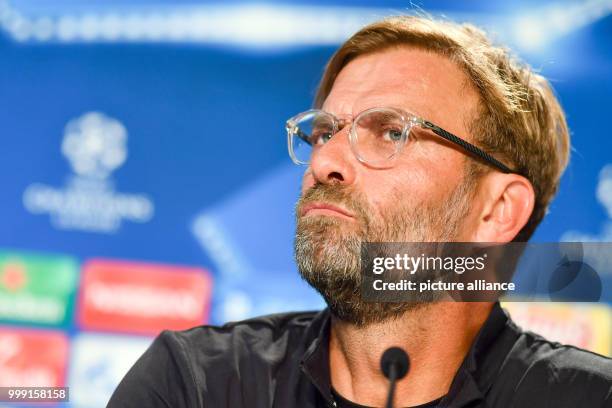 Liverpool's coach Juergen Klopp listens to a question during a press conference previously to the Champions League's qualifer match between 1899...
