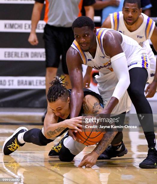 Jordan Adams of the Sons of Westwood and Johnathan Ivy of the D3 battle for a loose ball during the Western Regional of The Basketball Tournament...
