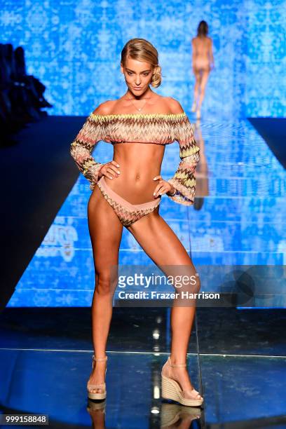 Model walks the runway for Luli Fama during the Paraiso Fashion Fair at The Paraiso Tent on July 14, 2018 in Miami Beach, Florida.