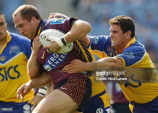 Darren Burns of the Broncos and Ian Hindmarsh of the Eels in action during the NRL semi final between the Parramatta Eels and the Brisbane Broncos...