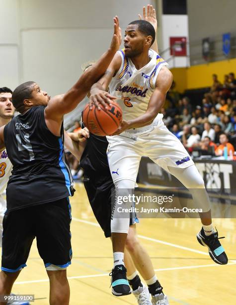 Khalif Wyatt of the Sons of Westwood makes a pass behind Jeff Gibbs of the D3 during the Western Regional game during The Basketball Tournament at...