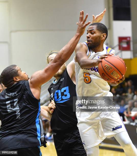 Khalif Wyatt of the Sons of Westwood makes a pass behind Jeff Gibbs of the D3 during the Western Regional game during The Basketball Tournament at...