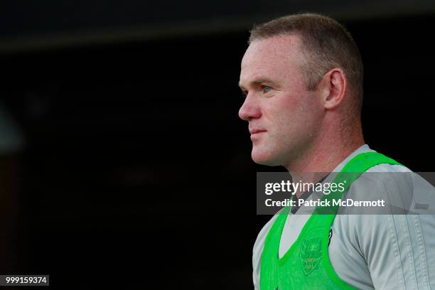 Wayne Rooney of DC United looks on before playing against the Vancouver Whitecaps during his MLS debut at Audi Field on July 14, 2018 in Washington,...