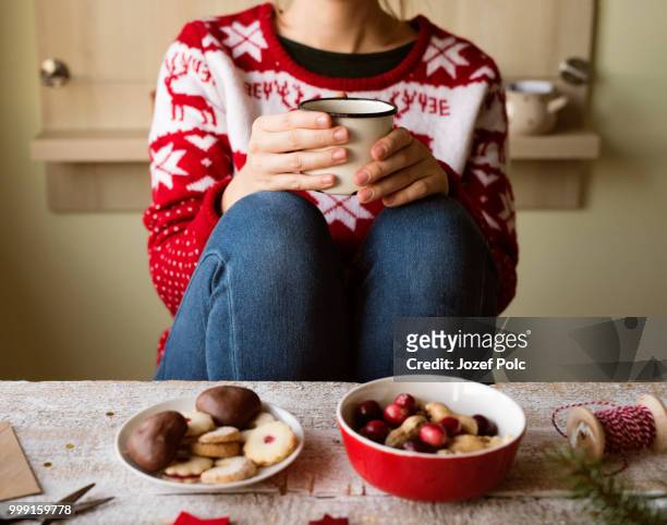 unrecognizable woman with coffee cup, christmas composition. - jozef polc stock pictures, royalty-free photos & images