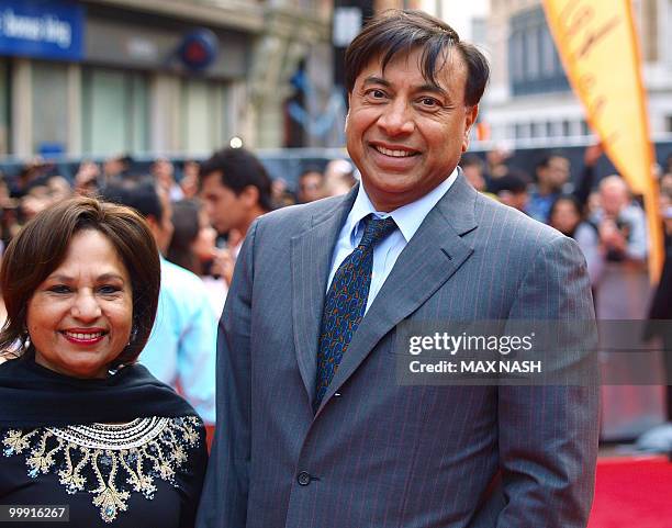 Indian steel magnate and billionaire Lakshmi Mittal poses with his wife Usha as he arrives at the European Premiere of the film 'Kites' directed by...