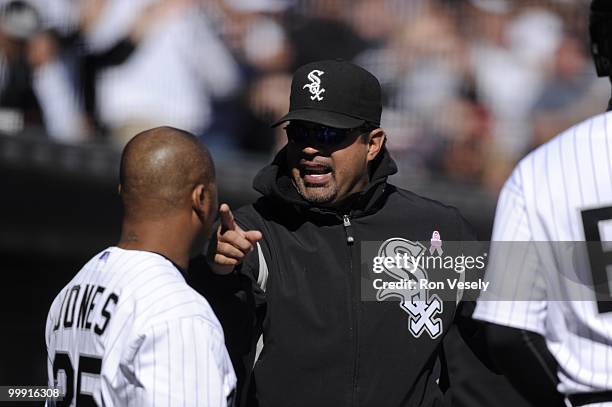 Manager Ozzie Guillen talks to Andruw Jones of the Chicago White Sox looks on during the game against the Toronto Blue Jays on May 9, 2010 at U.S....