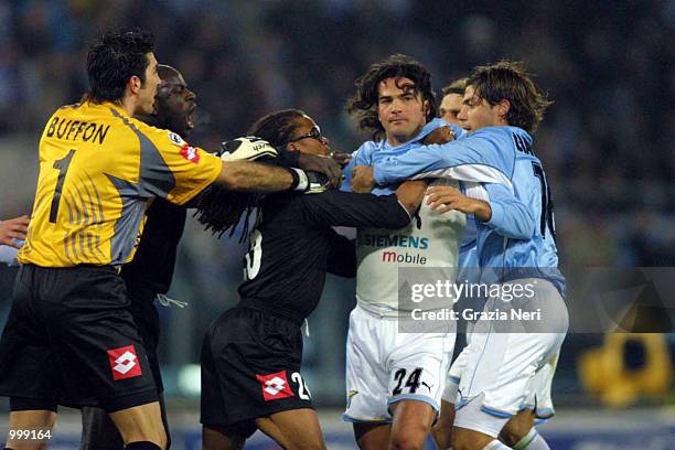 Fernando Couto and Giuliano Giannicchedda of Lazio fighting with Egar Davids of Juventus during the Serie A 12th Round League match between Lazio and...