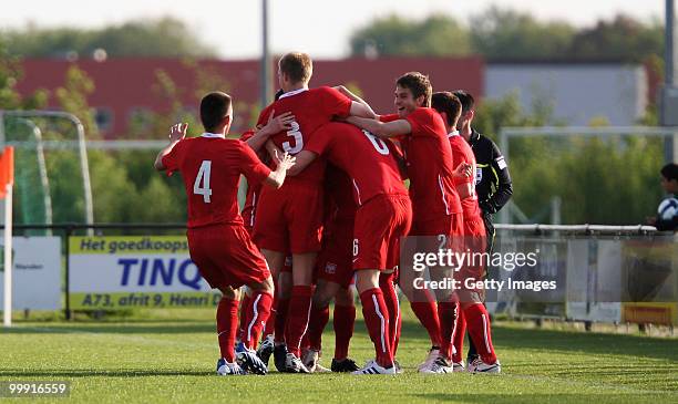 The team of Poland celebrates after scoring goal during the U19 Championship Elite Round match between Germany and Poland at Bakenbos on May 18, 2010...