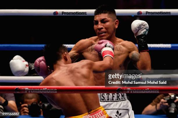 Edivaldo Ortega of Mexico fight with Jhack Tepora of Philippines during their World Featherweight boxing championship title bout in Kuala Lumpur,...