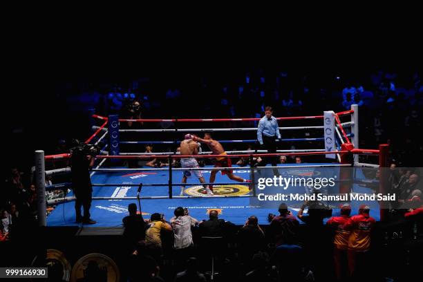 Edivaldo Ortega of Mexico fight with Jhack Tepora of Philippines during their World Featherweight boxing championship title bout in Kuala Lumpur,...