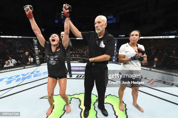 Cat Zingano celebrates her decision victory over Marion Reneau in their women's bantamweight fight during the UFC Fight Night event inside...