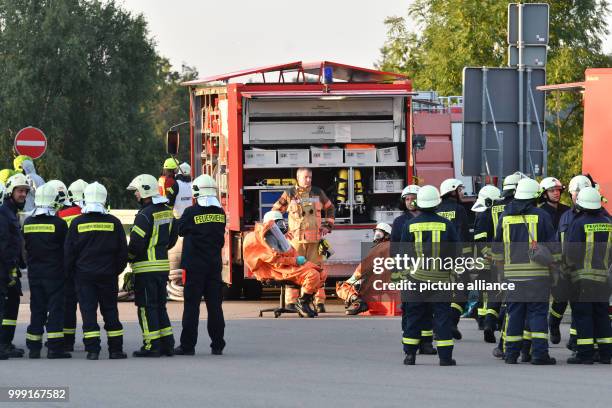 Firefighters photographed at the Walsleben rest stop in the state of Brandenburg, Germany, 15 August 2017. On the entrance to the rest stop is a...