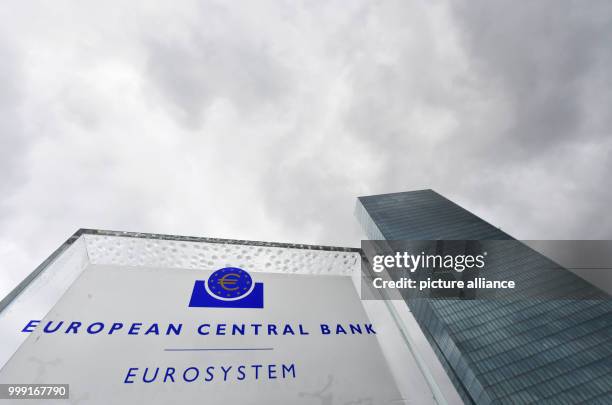 File picture dated 07 March 2017 showing a sign with the text "European Central Bank - Eurosystem" in front of the European Central Bank headquarters...