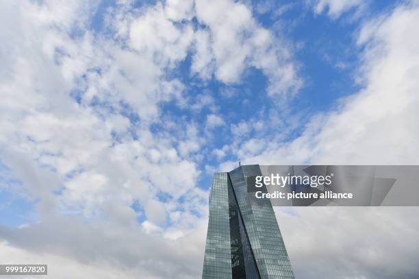 File picture dated 07 March 2017 showing clouds drifting away from above the European Central Bank headquarters in Frankfurt am Main, Germany. It was...