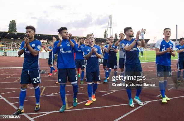 Schalke players Thilo Kehrer, Weston McKennie, Max Meyer, Daniel Caligiuri and Fabian Reese standing in the fan curve clapping after the 2-0 victory...