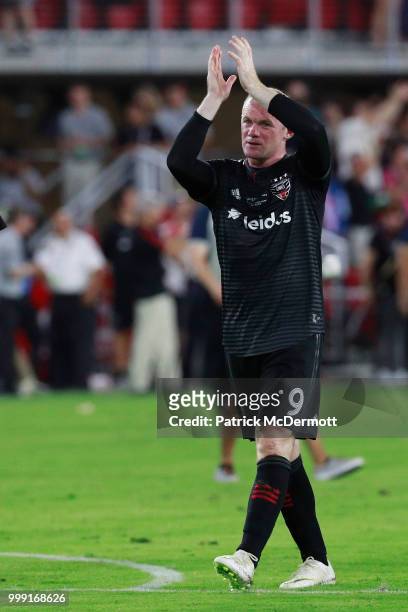 Wayne Rooney of DC United celebrates after DC United defeated the Vancouver Whitecaps 3-1 during his MLS debut at Audi Field on July 14, 2018 in...