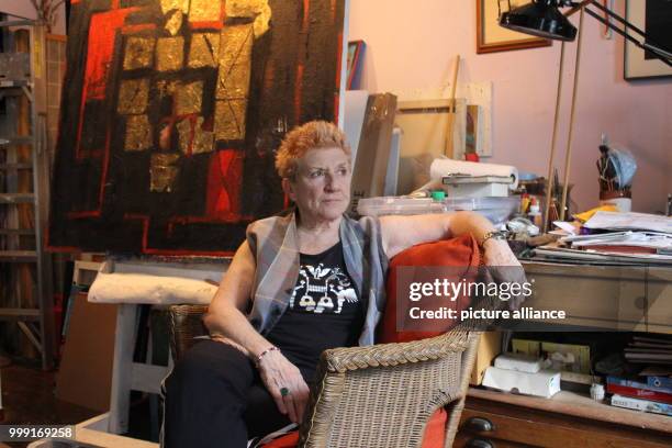 Artist Carol Massa sitting in front of her painting "The Last Curtain" in her house in New York, US, 14 August 2017. Massa is on exhibit in the...