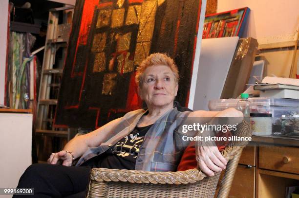 Artist Carol Massa sitting in front of her painting "The Last Curtain" in her house in New York, US, 14 August 2017. Massa is on exhibit in the...