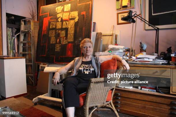 Artist Carol Massa sitting in front of her painting "The Last Curtain" in her house in New York, US, 14 August 2017. Massa is on exhibit in the...