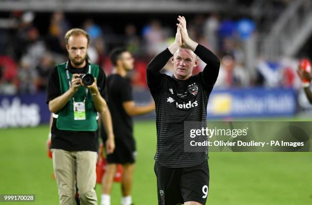 United player Wayne Rooney thanks the supporters after the Major League Soccer match between D.C. United and Vancouver Whitecaps FC at the Audi Field...