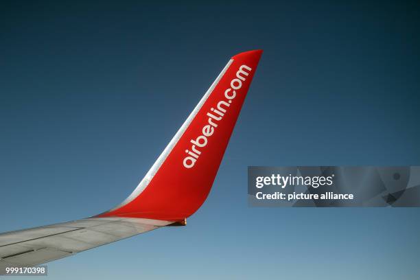 File picture dated 14 February 2017 showing airberlin.com written on the winglet of a Boeing 737 flying between Berlin and Cologne. Air Berlin has...