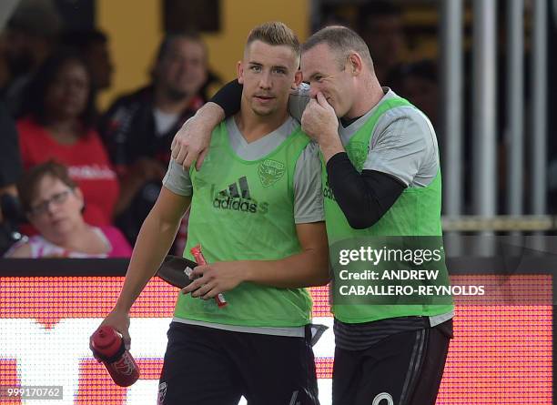 Wayne Rooney of DC United speaks with a teammate before the DC United vs the Vancouver Whitecaps FC match in Washington DC on July 14, 2018.