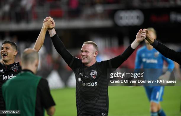 United player Wayne Rooney celebrates with the supporters after the Major League Soccer match between D.C. United and Vancouver Whitecaps FC at the...
