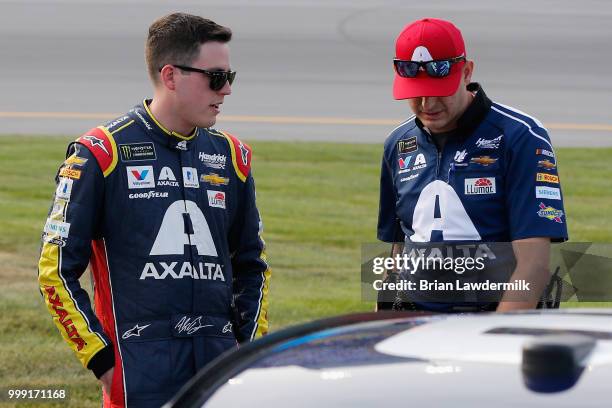 Alex Bowman, driver of the Axalta Chevrolet, stands on the grid with his crew chief Greg Ives prior to the Monster Energy NASCAR Cup Series Quaker...