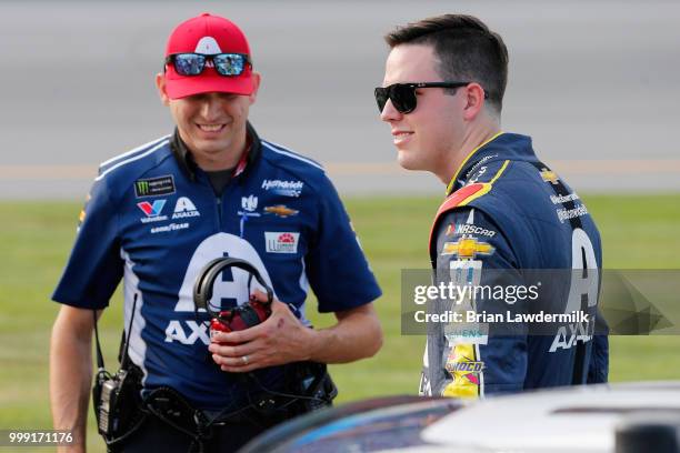 Alex Bowman, driver of the Axalta Chevrolet, stands on the grid with his crew chief Greg Ives prior to the Monster Energy NASCAR Cup Series Quaker...