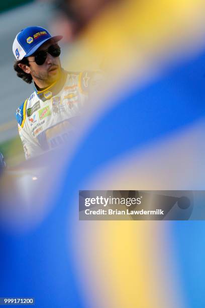 Chase Elliott, driver of the NAPA Auto Parts Chevrolet, stands on the grid prior to the Monster Energy NASCAR Cup Series Quaker State 400 presented...