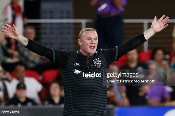 Wayne Rooney of D.C. United reacts in the second half against the Vancouver Whitecaps during his MLS debut at Audi Field on July 14, 2018 in...