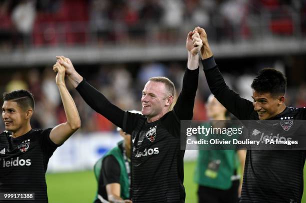 United player Wayne Rooney celebrates with the supporters after the Major League Soccer match between D.C. United and Vancouver Whitecaps FC at the...