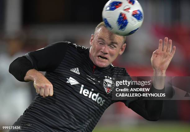 Wayne Rooney of DC United heads the ball during the DC United vs the Vancouver Whitecaps FC match in Washington DC on July 14, 2018.