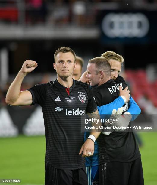United player Wayne Rooney celebrates with teamates after the Major League Soccer match between D.C. United and Vancouver Whitecaps FC at the Audi...