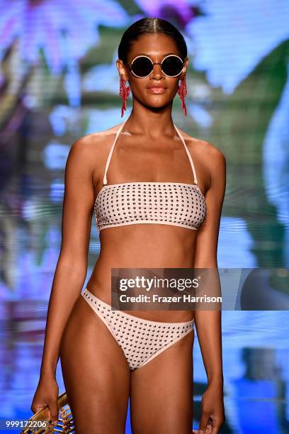 Model walks the runway for Sinesia Karol during the Paraiso Fashion Fair at The Paraiso Tent on July 14, 2018 in Miami Beach, Florida.