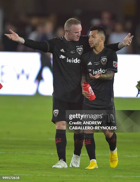 Wayne Rooney of DC United celebrates with Luciano Acosta after the DC United vs the Vancouver Whitecaps FC match in Washington DC on July 14, 2018.