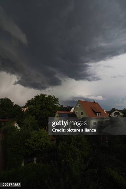 Dark thunder clouds can be seen above Ebing, Germany, 15 August 2017. Photo: Nicolas Armer/dpa