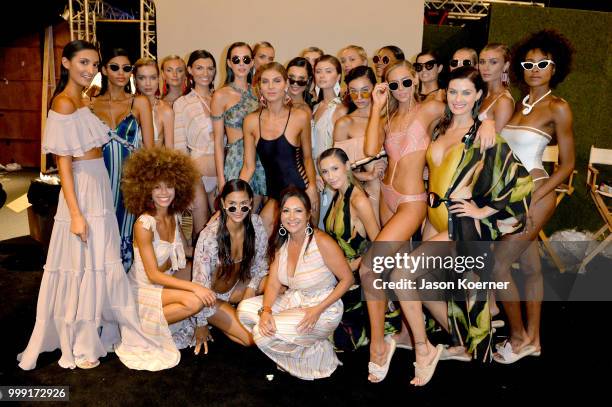 Designer Ana Paula Castro poses with models backstage for Sinesia Karol during the Paraiso Fashion Fair at The Paraiso Tent on July 14, 2018 in Miami...