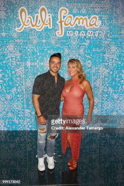 Luis Fonsi and Lourdes Hanimian pose backstage for Luli Fama during the Paraiso Fashion Fair at The Paraiso Tent on July 14, 2018 in Miami Beach,...