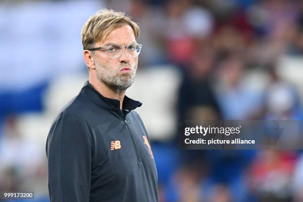 Liverpool's coach Juergen Klopp stands in the stadium during the Champions League's qualifer match between 1899 Hoffenheim and FC Liverpool in the...
