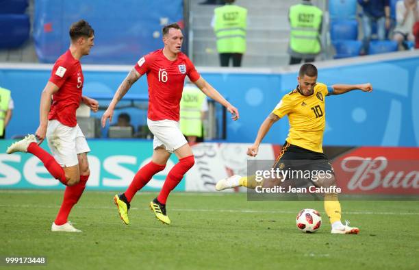 Eden Hazard of Belgium, followed by John Stones and Phil Jones of England is about to score the second goal of Belgium during the 2018 FIFA World Cup...