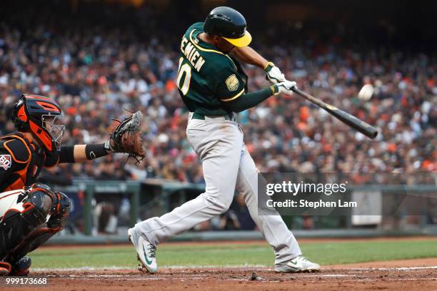 Marcus Semien of the Oakland Athletics connects for a fly ball to center field during the second inning against the San Francisco Giants at AT&T Park...