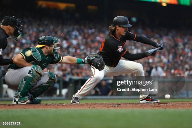 Jeff Samardzija of the San Francisco Giants bunts during the second inning against the Oakland Athletics at AT&T Park on July 14, 2018 in San...