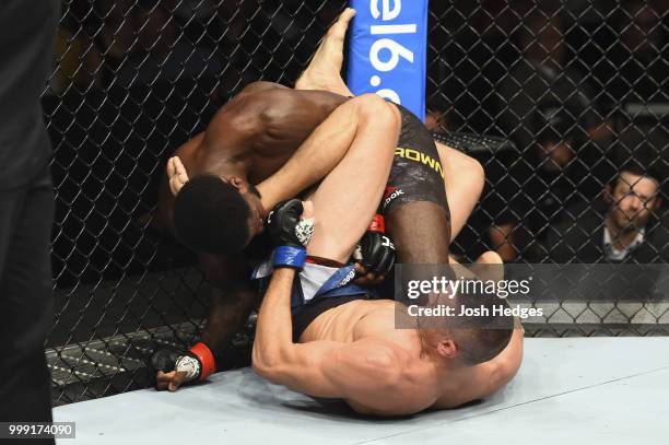 Niko Price punches Randy Brown of Jamaica in their welterweight fight during the UFC Fight Night event inside CenturyLink Arena on July 14, 2018 in...