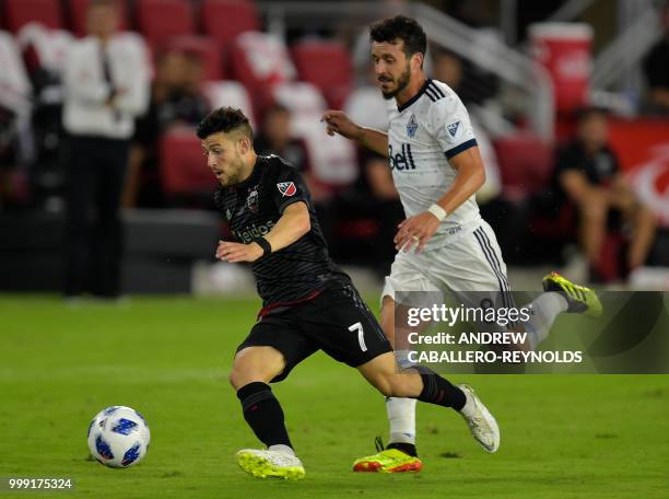 Paul Arriola of DC United vies for the ball with Felipe during the DC United vs the Vancouver Whitecaps FC match in Washington DC on July 14, 2018.