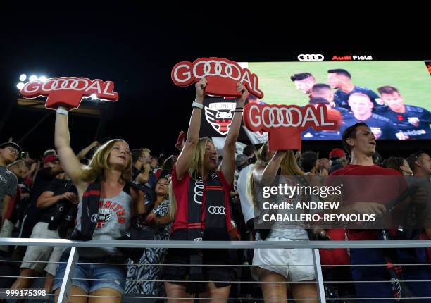 Fans celebrate during the DC United vs the Vancouver Whitecaps FC match in Washington DC on July 14, 2018.