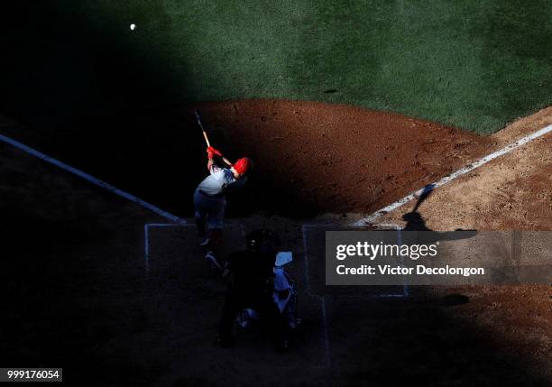 Ian Kinsler of the Los Angeles Angels of Anaheim singles to left field in the fifth inning during the MLB game against the Los Angeles Dodgers at...